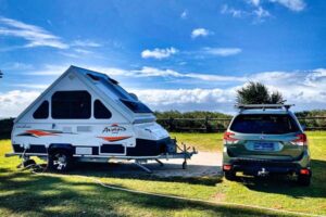 SUV parked with camper