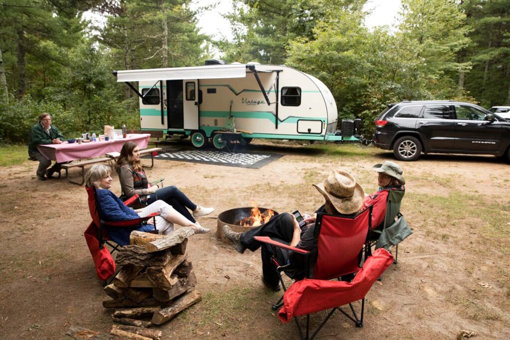 family camping with SUV hitched to camper